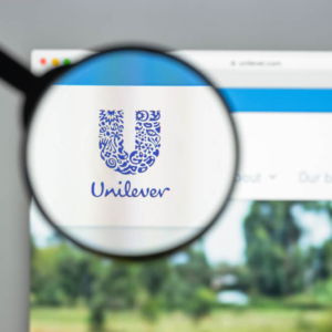 blurred magnifying glass with "Unilever" logo in focus in the lens