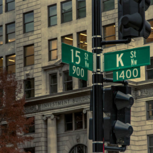 traffic light pole displays road signs at intersection of K and 15th streets. K street is the famous home of many lobbying firms in the United States capital.