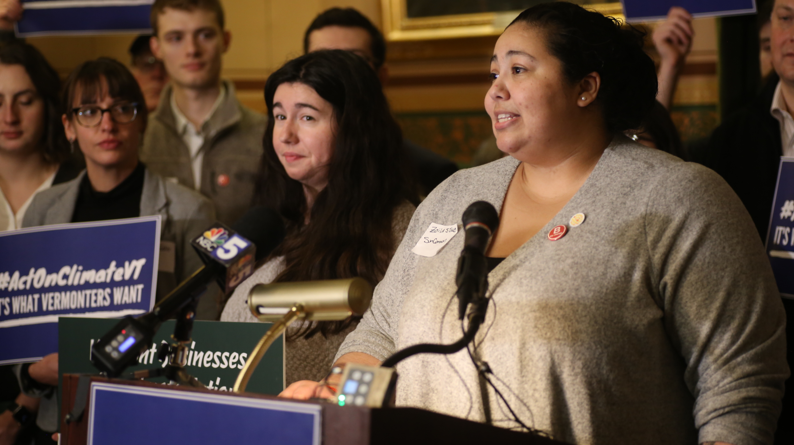 Women speaking at podium in press conference