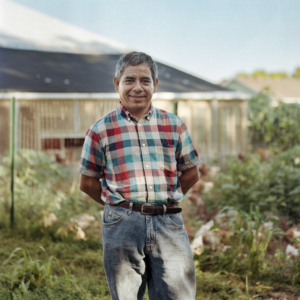 middle aged man standing in a farm -- portrait of Reginaldo Haslett-Marroquin