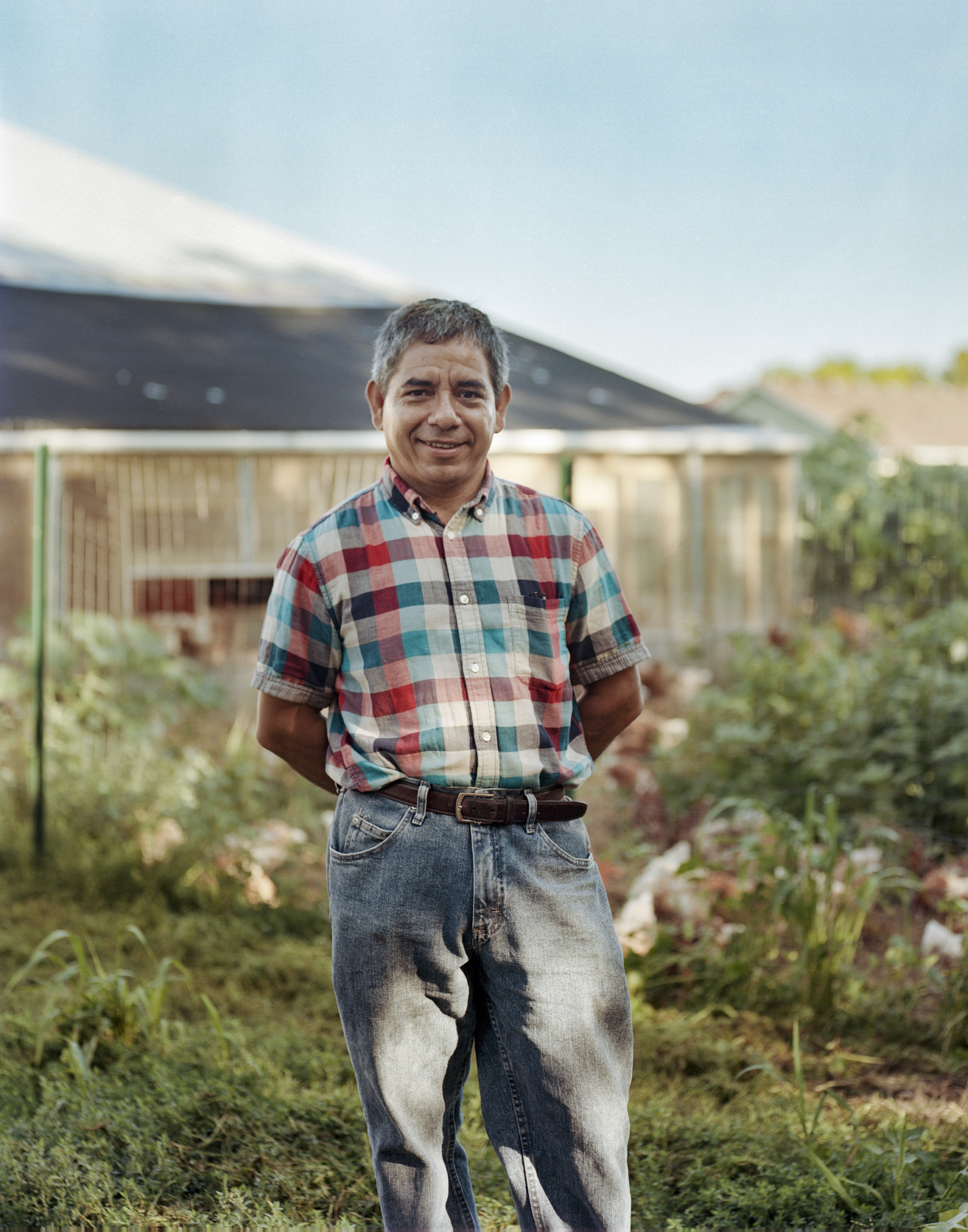 middle aged man standing in a farm -- portrait of Reginaldo Haslett-Marroquin