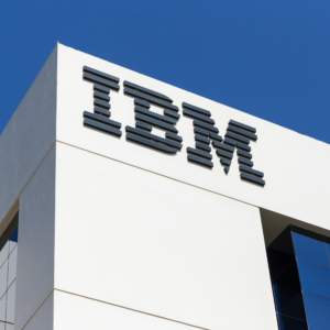 White office building with IBM sign and blue sky